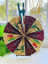 Load image into Gallery viewer, Handmade African Ankara Print Fabric Fan β Wax Print Folding Fan with Leather-Wrapped Handle