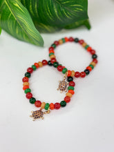 Load image into Gallery viewer, Pan-African Colors Glass Bead Stretch Bracelet with Leopard Turtle Charm | Handmade
